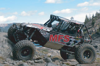 <img src= "comp_buggy.jpg" alt= "the MFS rock competition buggy prepares to mount massive boulders" />
