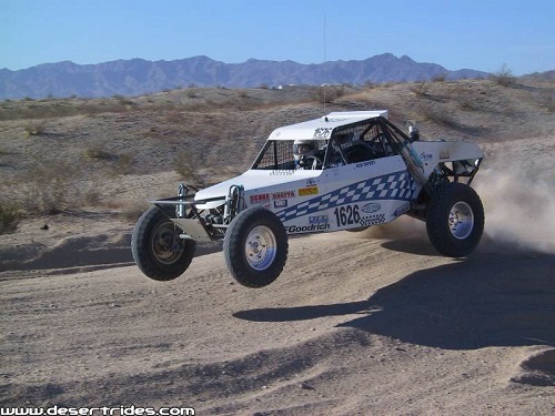 <img src= "class_1600.jpg" alt= "a 1600 class buggy races across the desert" />